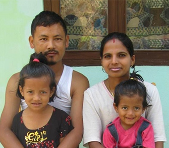 Indian family of four with two daughters.