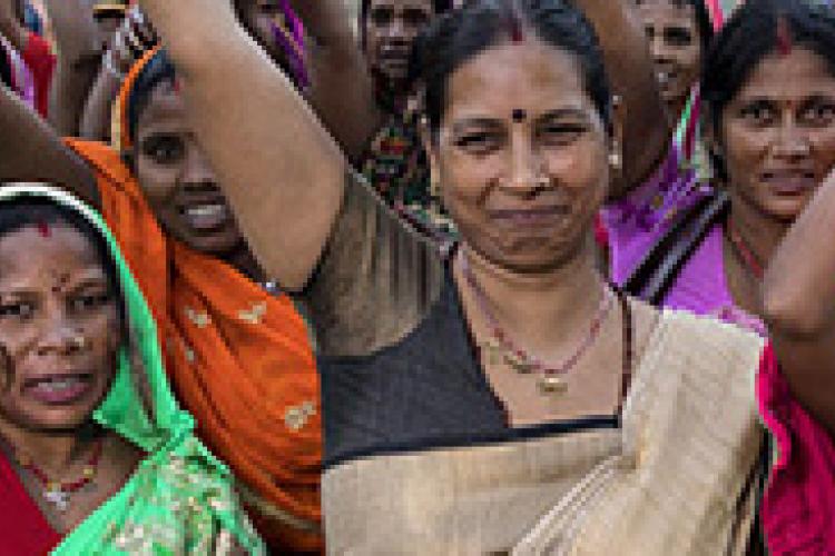 women raising arms in empowerment